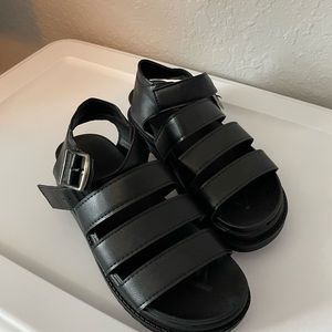 Similar to doc martens black new never used sandals.